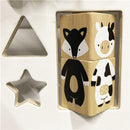 En ko og en ræv på træklodserne på gåvognen fra Nordic Play Nature